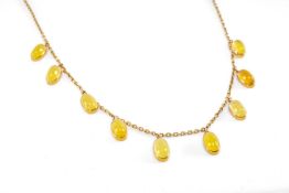 YELLOW METAL BELIEVED YELLOW MOONSTONE CABOCHON NECKLACE, 39.5cms long, 8.7gms Provenance: