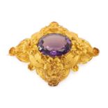 FINE YELLOW METAL FILIGREE AMETHYST BROOCH, rhombus shape with delicate flowerhead and scroll