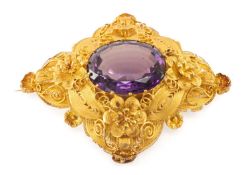 FINE YELLOW METAL FILIGREE AMETHYST BROOCH, rhombus shape with delicate flowerhead and scroll