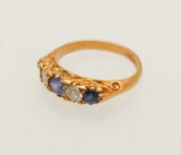 18CT GOLD SAPPHIRE & DIAMOND FIVE-STONE RING, set with three round cut sapphires, one being a