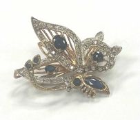 BUTTERFLY PENDANT/BROOCH, set with sapphires and tiny diamonds in 9ct yellow and white gold, 30 x