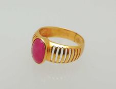 CABOCHON RUBY RING, stone approx. 9 x 6mms, unmarked polished yellow-gold ring with grid-form
