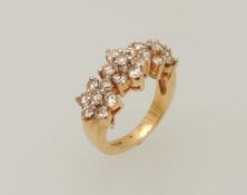 14CT GOLD DIAMOND TRIPLE FLOWERHEAD RING, set with twenty-one brilliant cut diamonds, approx. 0.