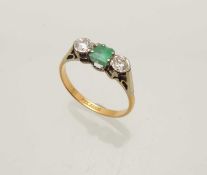 EMERALD & DIAMOND THREE-STONE RING, central square cut emerald approx. 0.3cts, bordered with
