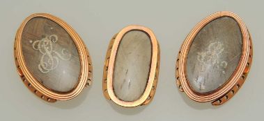 PAIR OF GEORGE III MOURNING LOCKETS, finished with plaited hair and seed pearl monogram, inscribed
