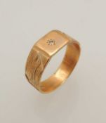 GENT'S 9CT GOLD SIGNET RING, set with a tiny diamond chip, on a textured band, size T, 4.7g
