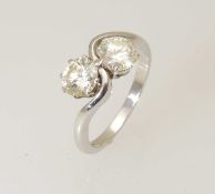 18CT WHITE GOLD DIAMOND TWO-STONE CROSSOVER RING, the two brilliants estimated as 0.9cts and