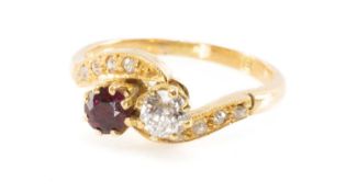 GOLD DIAMOND & RUBY CROSSOVER RING, old cut diamond, with 8 small diamonds to the millegrain
