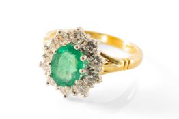 18CT EMERALD & DIAMOND CLUSTER RING, oval cut sapphire approx. 8 x 6mm, total diamond weight approx.
