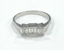 DIAMOND THREE STONE RING, the emerald cut stones totalling approx. 1ct, in box settings on a
