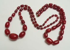 CHERRY AMBER COLOURED BEAD NECKLACE, largest bead 22 x 15mms, 53cms (l), 40g; and a further cherry