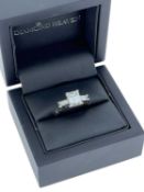 FINE PLATINUM THREE-STONE DIAMOND RING, central emerald cut diamond (8.3 x 6.5mm) approx. 2ct,