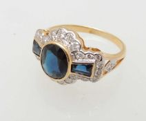 SAPPHIRE & DIAMOND CLUSTER RING, central oval cut sapphire approx. 1ct, flanked by sapphire