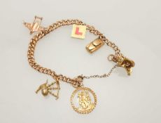 9CT GOLD CURB LINK CHARM BRACELET, supporting six hallmarked charms, 26.2g Provenance: private