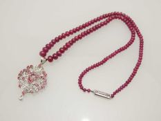 RUBY & DIAMOND PENDANT NECKLACE, probably Indian, palmette shaped pendant set with small round cut
