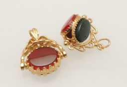 TWO 9CT GOLD CARNELIAN & HARDSTONE SWIVEL FOBS, 23mms and 21mms (diam.), total wt. 6.6g
