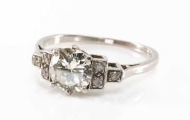 PLATINUM DIAMOND RING, the claw set round brilliant cut stone measuring 1.2cts approx., flanked by