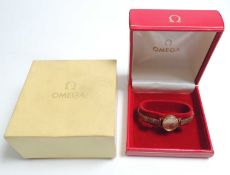 OMEGA 9CT GOLD LADIES' BRACELET WRISTWATCH, matte gold coloured elliptical dial with baton numerals,