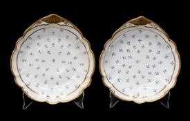SWANSEA PORCELAIN PAIR OF SHELL DISHES circa 1815-17, solid gilt rim and gilt fan moulded handle,