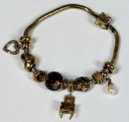 CLOGAU GOLD CHARM BRACELET, snake links supporting small number of charms included faceted smoky