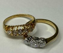 DIAMOND THREE-STONE RING in 18ct gold and platinum, old round cut diamonds totalling approx. 0.
