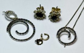 18CT WHITE GOLD GEM SET PENDANT NECKLACE, the pendant of concentric spiralled rings set with