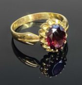 18CT GOLD GARNET DRESS RING, claw mounted oval cut stone, unmarked, size T, gross weight approx. 5.