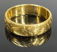 22CT GOLD FLORAL CHASED WEDDING RING, size N/O, 5.2g Provenance: private collection Cheshire