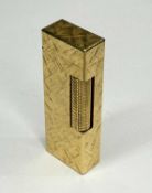 DUNHILL GOLD-PLATED CIGARETTE LIGHTER with brushed finish Provenance: private collection