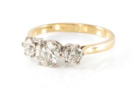 18CT GOLD THREE STONE DIAMOND RING, the three round brilliant cut, claw-set stones measuring 1.