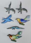 TWO ENAMELLED STERLING SILVER CUCKOO BROOCHES, 54mms and four further enamelled silver bird brooches