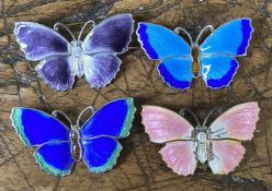 FOUR ENAMELLED STERLING SILVER BUTTERFLY BROOCHES, each 38mms, gross weight approx. 23gms