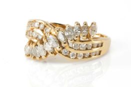 14K GOLD & DIAMOND CLUSTER CROSSOVER RING, shanked band of graduated marquise cut diamonds over