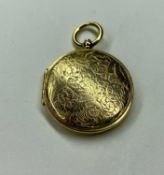 VICTORIAN GOLD PICTURE LOCKET, finely engraved with a running stag and foliate scrolls, probably