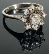 DIAMOND FLOWER HEAD CLUSTER RING, central brilliant cut stone approx. 0.25ct, bordered with eight