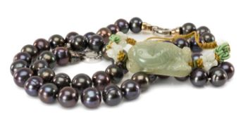 CARVED JADE CARP BRACELET, with modern TJC black pearl necklace and bracelet Provenance: private