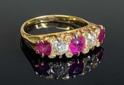 RUBY & DIAMOND FIVE-STONE RING, set with three cushion cut rubies, dispersed with two old round