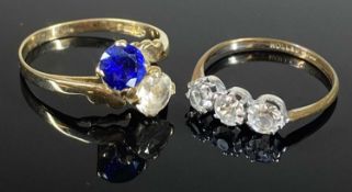 SYNTHETIC SAPPHIRE & WHITE STONE CROSSOVER RING in 9ct gold, size P, 2.2g; also a further paste
