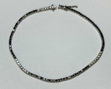 DIAMOND LINE BRACELET in 18ct white gold, set with tiny round-cut stones, 18cms (l), 7.6gms