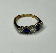 EDWARDIAN SAPPHIRE & DIAMOND FIVE-STONE RING, the central old round cut diamond approx. 0.45cts,