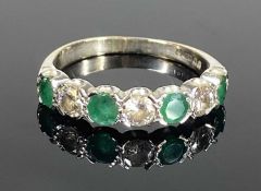 EMERALD & DIAMOND SEVEN-STONE RING, all round-cut stone, the diamonds total approx. 0.7ct, colour