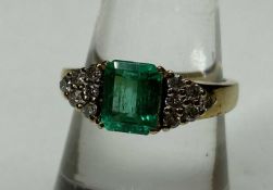 EMERALD & DIAMOND CLUSTER RING, rectangular cut emerald approx. 1.25cts, flanked with twelve small