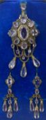 FRENCH PARURE, late 19th century, comprising a gilt brooch set with white oval cut stones, in a