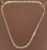9CT TWO-COLOUR GOLD KEYED LINK NECKLACE, 44cms (l), 5.8gms Provenance: private collection