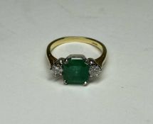 EMERALD & DIAMOND THREE-STONE RING, square cut emerald approx. 2cts, flanked by brilliant cut