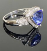 18CT WHITE GOLD TANZANITE & DIAMOND CLUSTER RING, trilliant cut tanzanite approx. 1.5ct, bordered