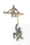 SILVER MONKEY BROOCH, set with rose-cut diamonds, with cabochon ruby and emeralds, stamped '925' pin