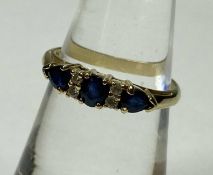 SAPPHIRE & DIAMOND CLUSTER RING, in 18ct yellow gold, centred with an oval cut sapphire, bordered