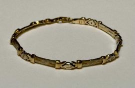 9CT GOLD TWO COLOUR GOLD BAR LINK BRACELET, set with small round-cut white stones, marked 'Flowers',