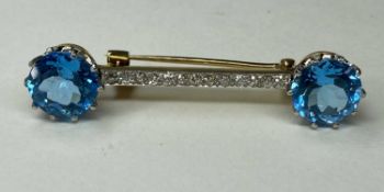 STRIKING BLUE TOPAZ & DIAMOND BAR BROOCH, the round cut topaz of good saturation, on a bar set